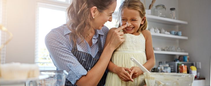 Mother and daughter baking together