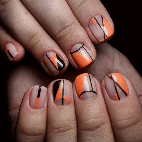 Оранжево-черный маникюр с геометрическим узором