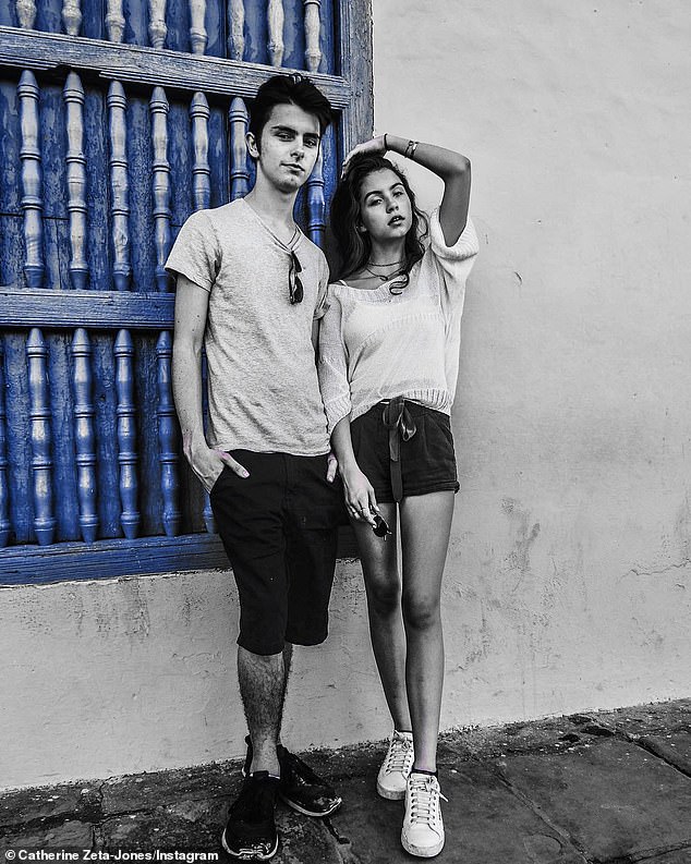 Teens: Joining the Douglases were their 18-year-old son Dylan Michael and 15-year-old daughter Carys Zeta, who posed for their mother in an artsy b&w street snap on Tuesday