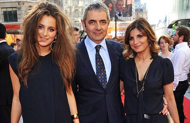 A rare public appearance: Rowan with then wife Sunetra and daughter Lily at the Johnny English Reborn premiere in 2011