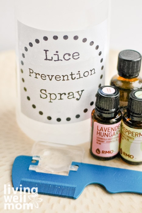 lice prevention spray with essential oils and magnifying glass lice comb