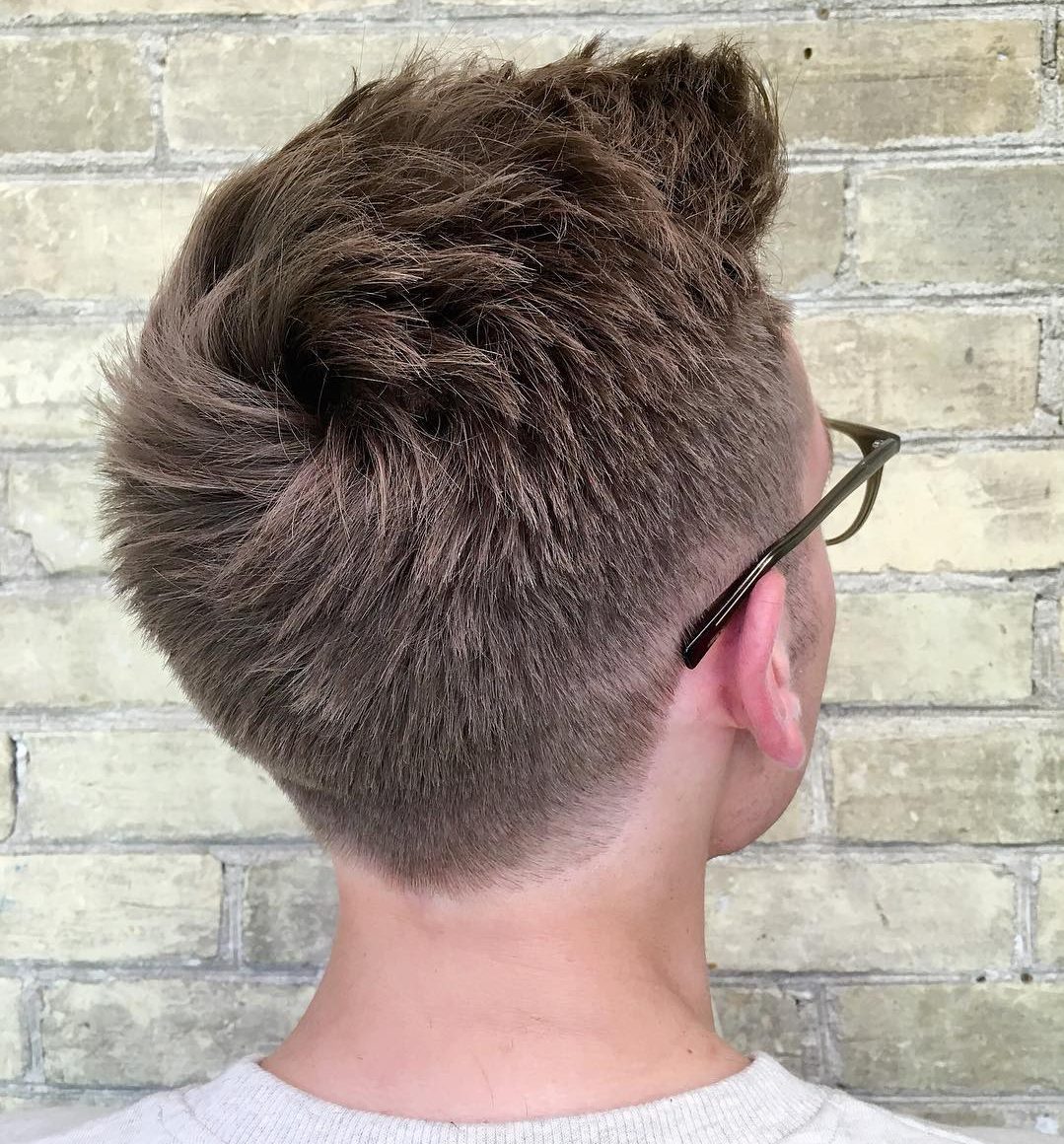Thick textured haircut with low fade